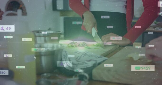 Cook slicing veg with knife on board chopping showing cooking badges counting while helper syncing