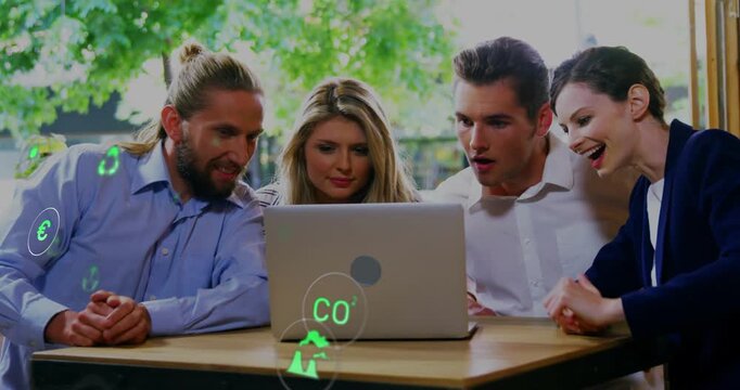 Team leaning around laptop watching update spawning green energy icons, evaluating impact