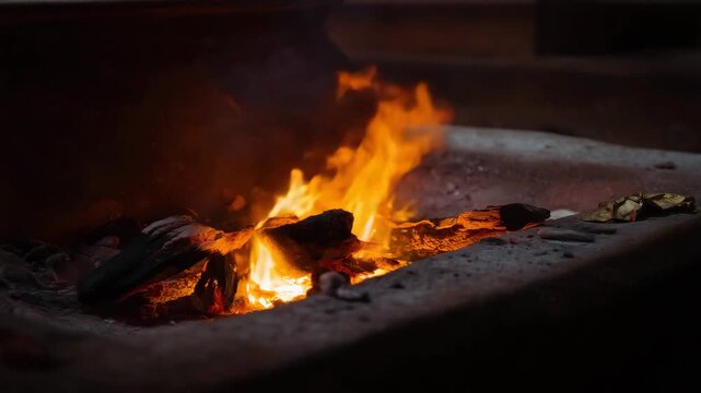 Funeral pyre with rising smoke and glowing embers, traditional cremation ritual, sacred ceremony, cultural heritage, spiritual farewell, solemn atmosphere
