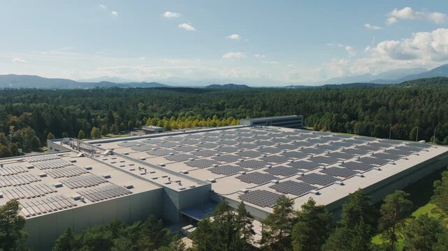 A large warehouse with solar panels on the roof. The center is part of eco-friendly efforts in logistics.