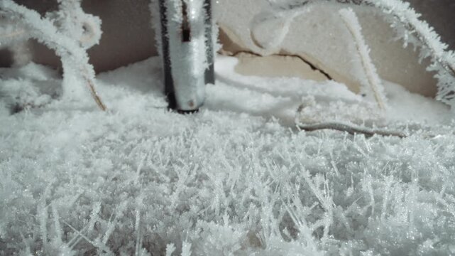 Closeup frost around metal probe, thermometer or sensor shaft encrusted with hoarfrost, tangled cables and crystalline spikes on surface, clinical pale light, scientific monitoring vibe during nuclear