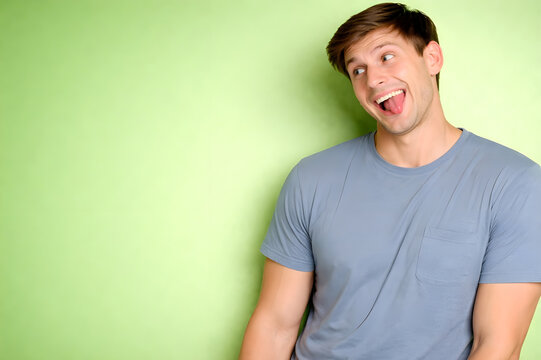 Man on right side with goofy silly face, tongue slightly out, funny meme reaction, looking left, left side green screen Background