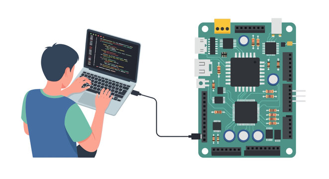 Programmer coding on laptop connected to electronic circuit board.