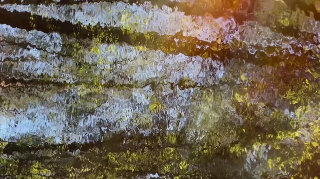 Dynamic reflection of tree trunks and the sky in water, creating distinct horizontal patterns and ripples. The scene includes blue, green, and brown hues with a sunlight glint.