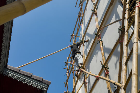 Working at heights, The workers are repairing the house, painted