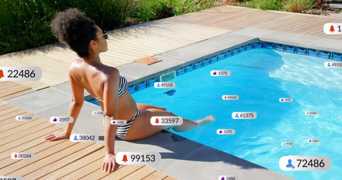 Animation of social media notifications over woman sitting by sunny pool