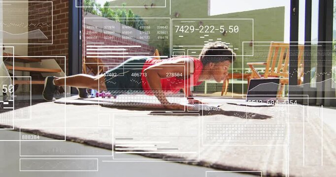 Man performing plank push-up in home gym, following laptop fitness cues with HUD overlays layered