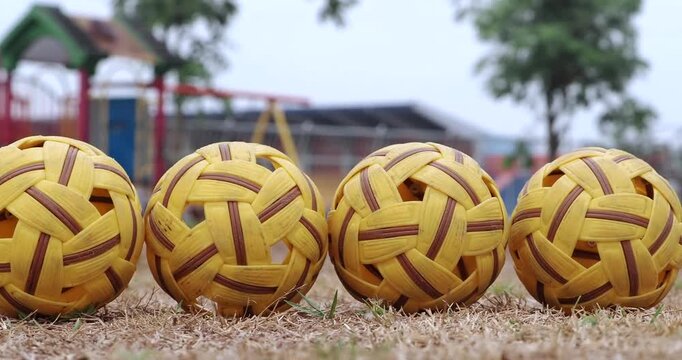 Sepak takraw balls are used for training on the ground.