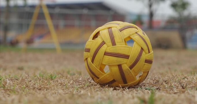 Sepak takraw balls are used for training on the ground.