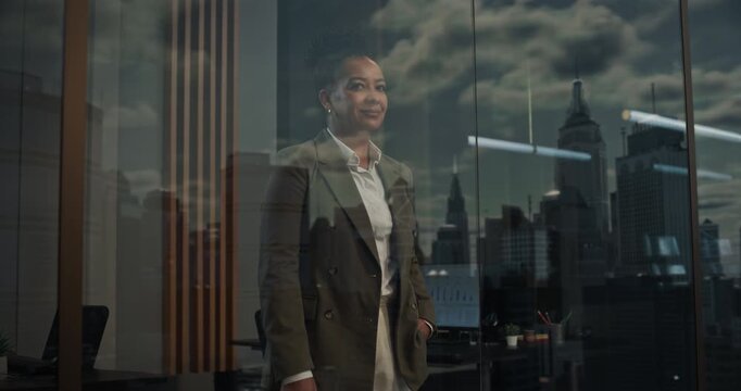 Timelapse with Moving Sun: Black Businesswoman in a High-rise Office Looking out of Window on Day Passing. Special Effect Concept about Progress, Time, Productivity and Big City Fast Paced Lifestyle