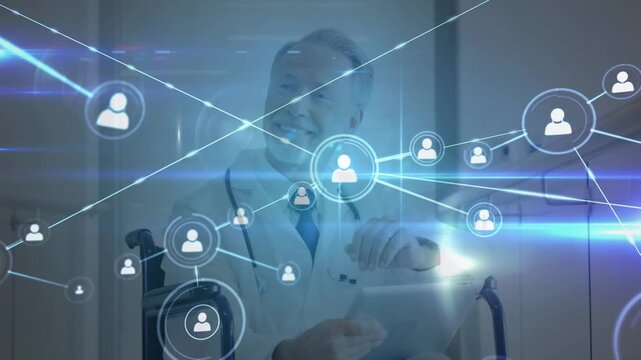 Network of profile icons against caucasian senior male doctor on wheelchair using digital tablet