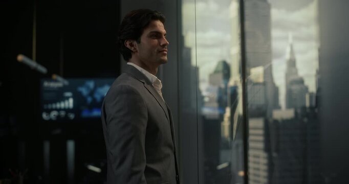 White Businessman in a Gray Suit Stands in a Modern Office, Thinking Through Startup Strategy and Finance Goals With a Slight Smile, Embodying Entrepreneurship, Economics, Leadership and Success