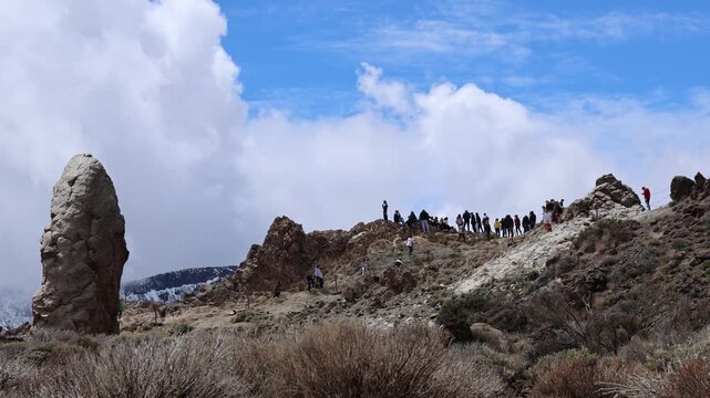 Snow covered Teide volcano landscape after storm Therese in Tenerife Canary Islands, dramatic clouds, volcanic terrain and winter conditions in subtropical island