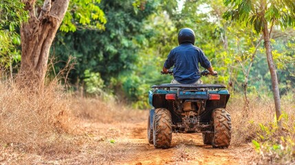 Fototapeta premium Man riding atv offroad vehicle track outdoor sport action adventure dirt speed motion trail extreme recreation activity nature landscape excitement power driving leisure concept