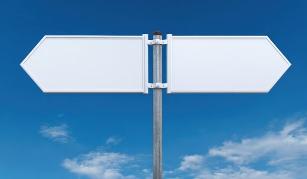 A blank direction sign featuring two white, arrow-shaped plaques, pointing left and right, attached to a metal post against a blue sky with clouds