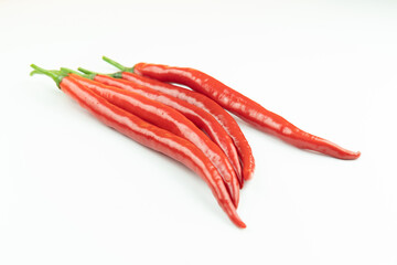 Naklejka premium Fresh red peppers on a white background