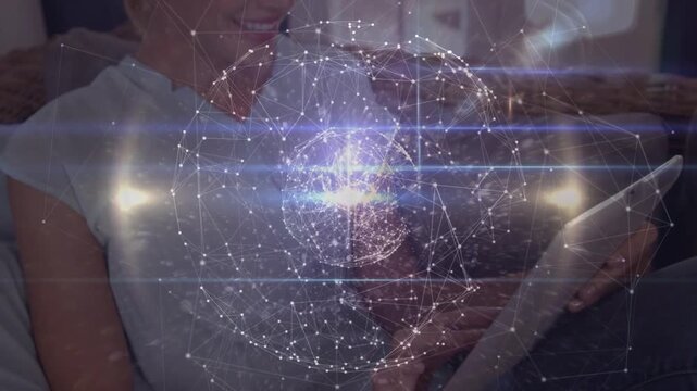 Animation of globe of network of connections over schoolboy writing