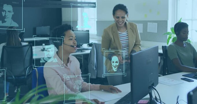 Animation of world map and icons over diverse female coworkers working in office