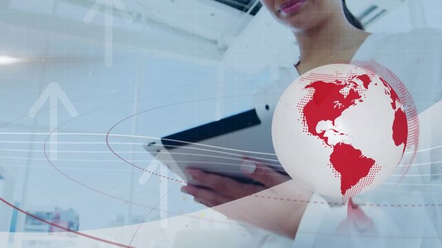 Animation of globe and arrow icons against businesswoman using digital tablet at office