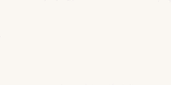 A plain off white or cream colored background with minimal visual detail