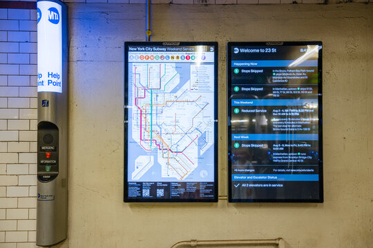 New York City, New York, USA - 08.03.2024: Digital screens display the New York City subway map and service updates inside a Manhattan station. The MTA information boards provide transit alerts and