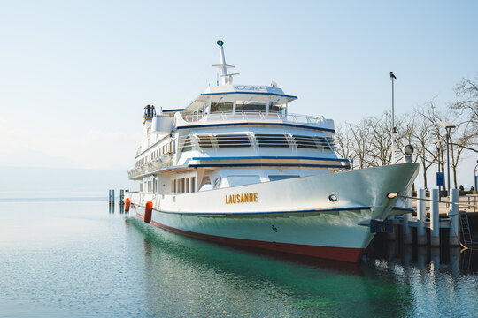 Lausanne, Switzerland, March 21, 2026. White Lausanne passenger ship docked at Ouchy harbor on the calm turquoise waters of Lake Geneva