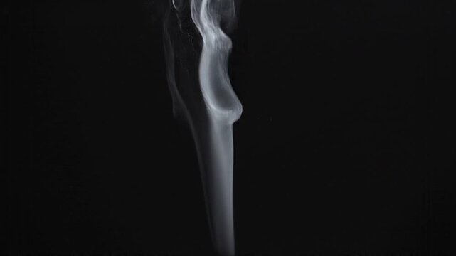 Slow Motion White Wispy Smoke Rising on Black Background