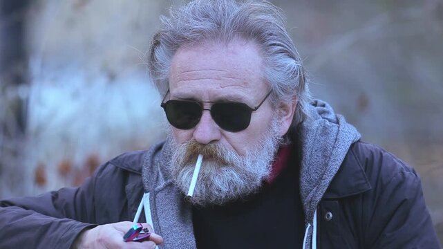 City Life Rhythms - Senior Man Smoking and Phoning on Busy Street