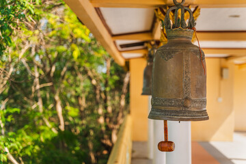 Obraz premium Traditional temple bell hanging in Wat Phra Yai on Koh Samui island in Thailand