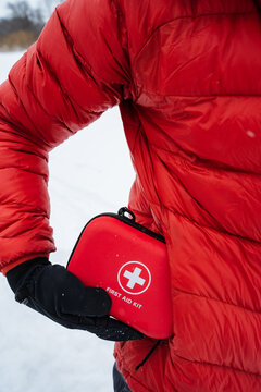 Quick Reach First Aid Container. First Aid Kit Positioned For Emergency Accessibility. Emergency Medical Kit Conveniently Placed At Hip Height For Rapid Response In Outdoor Settings