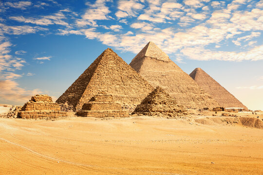 The Great Pyramids of Giza desert under a colorful sunset sky, Egypt