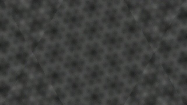 Close-up of textured metallic surface with perforations and shadows
