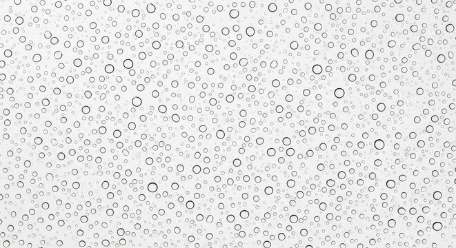 Black circles of various sizes on a white background texture pattern