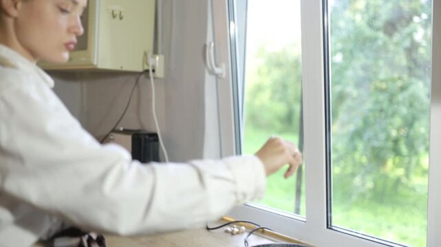 A female chef cooks in the kitchen during the day