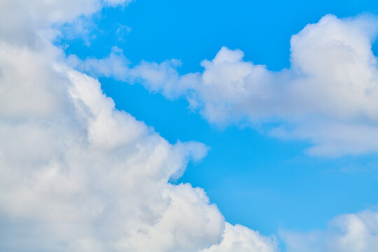 Close-up of blue sky with huge white clouds