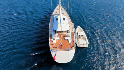 Aerial drone photo of beautiful sail boat anchored in deep blue Aegean Sea © aerial-drone