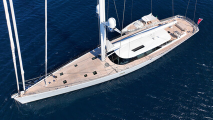 Aerial drone photo of beautiful sail boat anchored in deep blue Aegean Sea © aerial-drone