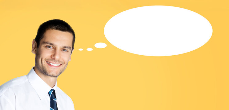 Portrait image - happy smile business man in corporate white shirt, stripes necktie tie. Young businessman isolated against orange yellow background. White empty mockup think bubble, thought float