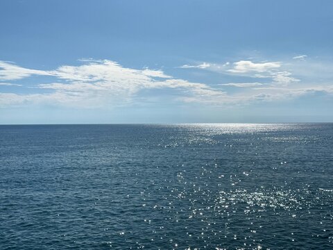 Open blue sea and sunny clear sky.