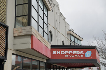 Obraz premium exterior building facade and sign of Shoppers Drug Mart, a pharmacy chain, located here at 1601 Bayview Av, East York, Toronto