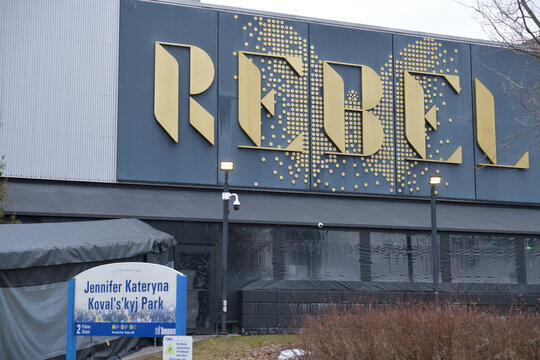 exterior building and sign of Rebel and City of Toronto sign at Jennifer Kateryna Koval's'kyj Park, Polson St