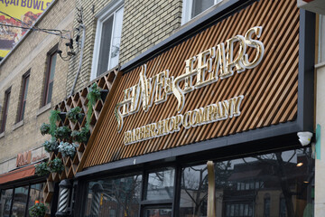 Fototapeta premium exterior building facade and sign of Shave & Shears Bayview Leaside, a barber shop, located at 1609 Bayview Av, Toronto