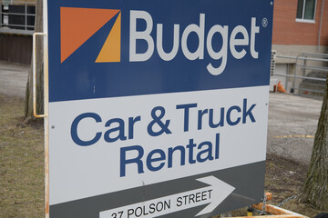 Fototapeta premium roadside sign of Budget Car & Truck Rental located at 37 Polson St, Toronto