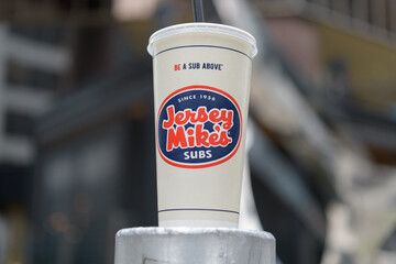 Fototapeta premium discarded beverage cup of Jersey Mike's, an American fast-food submarine sandwich chain, Toronto