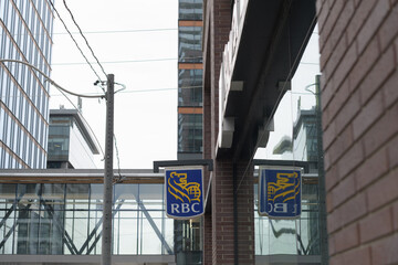 Obraz premium wall mounted projecting sign outside RBC Royal Bank - Meeting Place at 134 Queens Quay E, Toronto