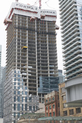 Fototapeta premium east tower of Forma, a condominium complex, designed by Frank Gehry, located at 266 King St W, Toronto