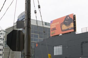 Fototapeta premium east facing truss-frame billboard or a lattice-work spectacular with advertising for Reese's Lava Big Cup on Queens Quay E (viewed from Small St and Lake Shore Blvd E), Toronto