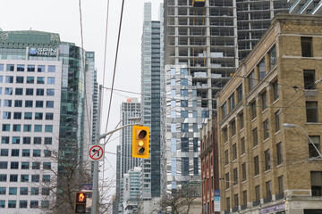 Fototapeta premium looking west on King St W with view of Forma Condominiums (under construction), Spin Master, Hyatt Regency, from Simcoe St, Toronto