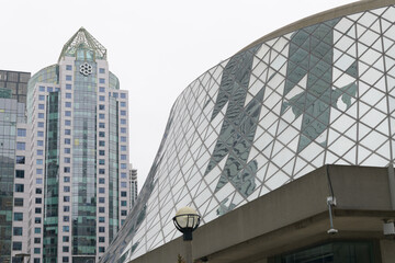 Obraz premium exterior of Metro Hall and detail of Roy Thomson Hall viewed from Simcoe St, Toronto