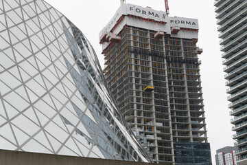 Obraz premium exterior of Roy Thomson Hall and Forma Toronto condominium viewed from Simcoe St near King St W